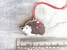 Load image into Gallery viewer, Hedgehog Christmas decoration. Hedgehog and stocking, small wooden, ethically sourced wood. Cute Christmas tree ornament