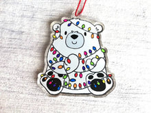 Load image into Gallery viewer, Polar bear Christmas tree decoration. Recycled acrylic Christmas ornament, polar bear tangled up in rainbow coloured fairy lights