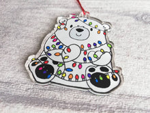 Load image into Gallery viewer, Polar bear Christmas tree decoration. Recycled acrylic Christmas ornament, polar bear tangled up in rainbow coloured fairy lights
