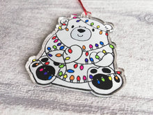 Load image into Gallery viewer, Polar bear Christmas tree decoration. Recycled acrylic Christmas ornament, polar bear tangled up in rainbow coloured fairy lights