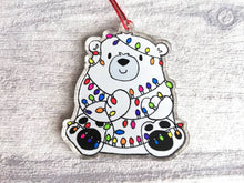 Load image into Gallery viewer, Polar bear Christmas tree decoration. Recycled acrylic Christmas ornament, polar bear tangled up in rainbow coloured fairy lights