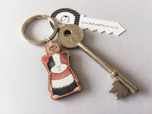 Load image into Gallery viewer, Guinea pig keyring, wooden cavy key fob, tri colour guinea pig key chain, wood bag charm, responsibly resourced wood