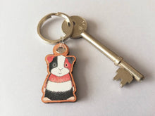 Load image into Gallery viewer, Guinea pig keyring, wooden cavy key fob, tri colour guinea pig key chain, wood bag charm, responsibly resourced wood