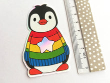 Load image into Gallery viewer, Penguin iridescent holographic vinyl sticker, rainbow and star jumper, boo the penguin sticker
