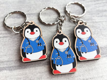 Load image into Gallery viewer, Nurse penguin keyring, nursing wooden key fob, eco friendly wood, Boo the penguin key chain, bag charm