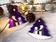 Load image into Gallery viewer, Penguin and star decoration. Eco friendly, purple recycled acrylic Christmas ornament, penguins in the snow
