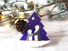 Load image into Gallery viewer, Penguin and star decoration. Eco friendly, purple recycled acrylic Christmas ornament, penguins in the snow
