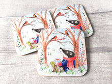 Load image into Gallery viewer, Winter badger design, with trees, snowdrops and robins. Printed on to a glossy square coaster
