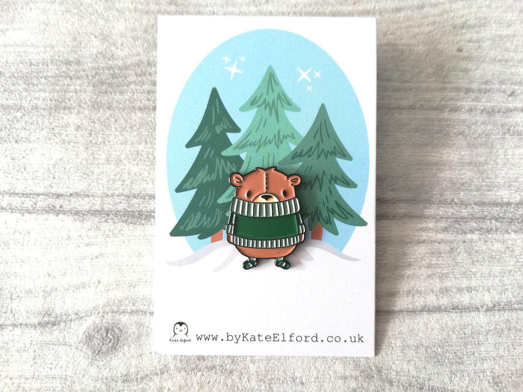 Cute brown bear wearing a dark green jumper enamel pin