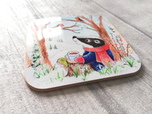 Load image into Gallery viewer, Badger sat under a tree with two robins. Winter countryside design with snowdrops. Square glossy small coaster
