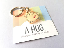 Load image into Gallery viewer, A hug keyring, cute positive mini key fob, friendship, post a hug, supportive, recycled acrylic
