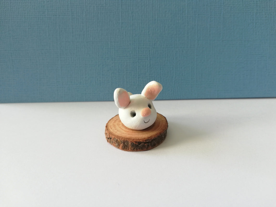 Mini pottery bunny on wood base