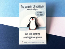 Load image into Gallery viewer, A little cartoon penguin enamel pin on a backing card with the wording the penguin of positivity wants to tell you, you are the best. Just keep being the amazing person you are
