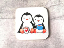 Load image into Gallery viewer, Two cute penguins sat having a cup of tea. Printed on a square coaster
