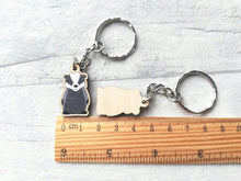 Load image into Gallery viewer, Mini badger keyring next to a ruler as a size guide
