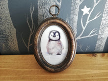 Load image into Gallery viewer, Cute watercolour penguin chick, in an oval aged effect frame
