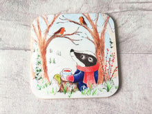 Load image into Gallery viewer, Badger sat under a tree with two robins. Winter countryside design with snowdrops. Square glossy small coaster
