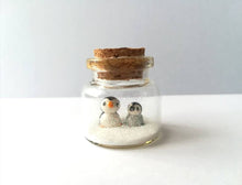 Load image into Gallery viewer, Miniature penguin Christmas decoration. Little pottery penguins and chick in a glass bottle. Christmas penguin mini ornament, mothers day
