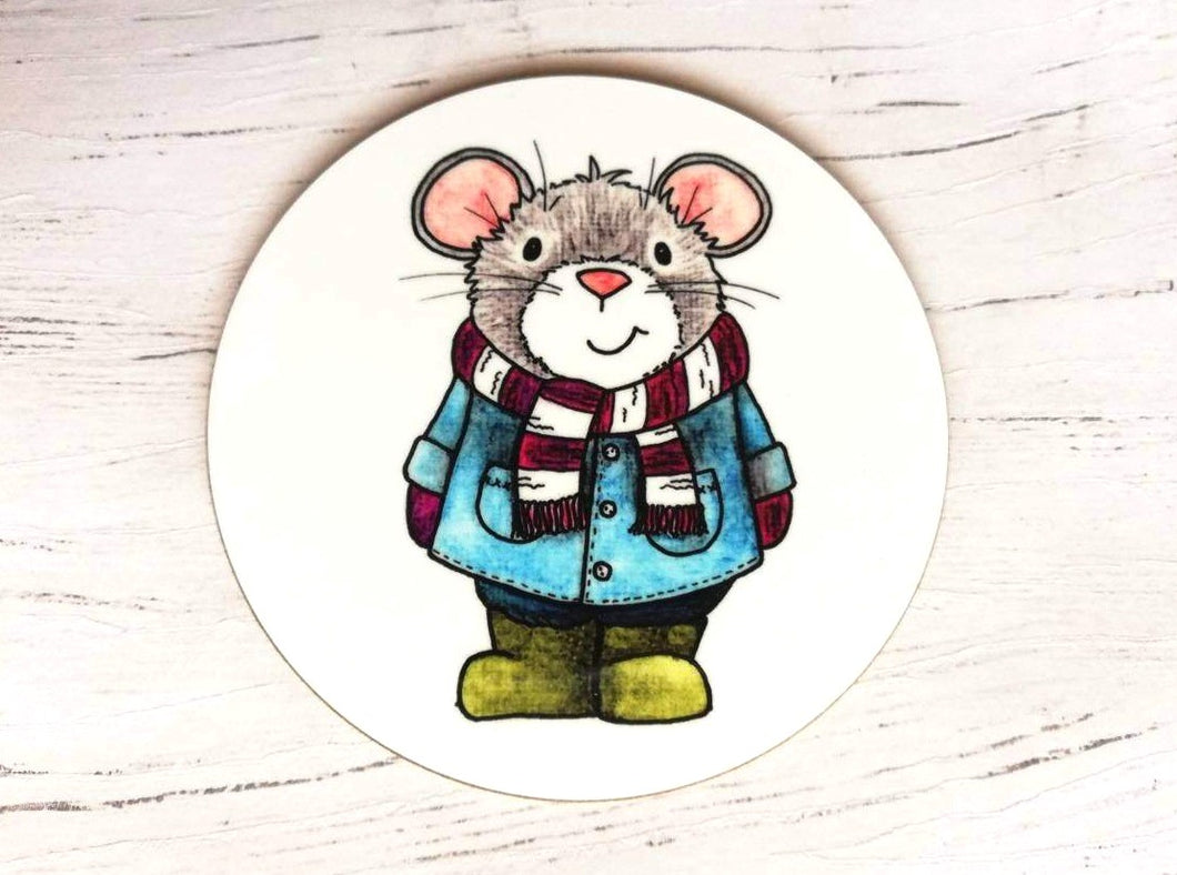 Little grey mouse in a blue coast and green wellies. Design is printed on a round white coaster