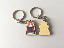 Load image into Gallery viewer, Mini guinea pig reading a book keyring, small wooden key fob, ethically sourced wood, guinea pig and books key chain, bag charm
