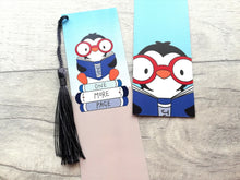 Load image into Gallery viewer, Penguin bookmark. Penguin is sat on a pile of books. The edge of the books has the words just one more page. Penguin is wearing red framed glasses.
