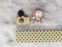 Load image into Gallery viewer, Christmas penguin wooden pin brooch, Cute little penguin badge, holding a Christmas stocking, eco friendly wood
