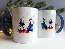 Load image into Gallery viewer, Christmas Penguins mug - Ceramic Mug - Winter Penguin Design - Dishwasher Safe Mug - Blue Handle Mug - Cute Penguin Gift

