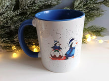 Load image into Gallery viewer, Christmas Penguins mug - Ceramic Mug - Winter Penguin Design - Dishwasher Safe Mug - Blue Handle Mug - Cute Penguin Gift
