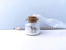 Load image into Gallery viewer, Miniature penguin Christmas decoration. Little pottery penguins and chick in a glass bottle. Christmas penguin mini ornament, mothers day
