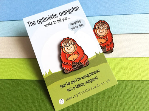 The optimistic orangutan enamel pin