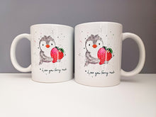 Load image into Gallery viewer, A mug with a penguin holding a strawberry and the wording I love you berry much. The photo shows both sides of the mug with a matching design 

