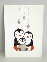 Load image into Gallery viewer, Penguin print, with hand painted silver glitter stars. Two parent penguins with a penguin chick. 

