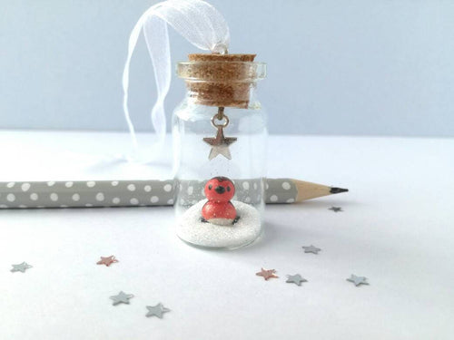 Robin Christmas decoration. Little pottery robin in a mini glass bottle. Miniature Christmas robin ornament