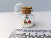 Load image into Gallery viewer, Miniature hedgehog and red toadstool Christmas decoration. Little pottery hedgehog in a glass bottle. Christmas woodland mini ornament
