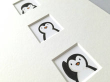 Load image into Gallery viewer, Little penguins print, three little penguins waving and peeking up and down at each other
