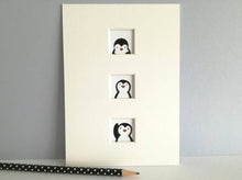 Load image into Gallery viewer, Fun unusual penguin print. Three small windows in a 7 x 5 inch mount, with a penguin in each one
