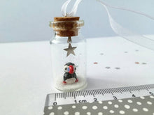 Load image into Gallery viewer, Puffin Christmas decoration. Little pottery puffin in a miniature glass bottle. Mini Christmas puffin ornament
