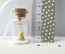 Load image into Gallery viewer, Cockatiel Christmas decoration. Little pottery cockatiel in a miniature glass bottle. Mini Christmas grey and yellow bird ornament

