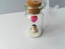 Load image into Gallery viewer, Miniature penguin gift. Little pottery penguin in a glass bottle. Red love heart mini penguin ornament

