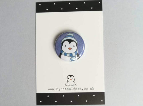 Penguin in hat and scarf badge