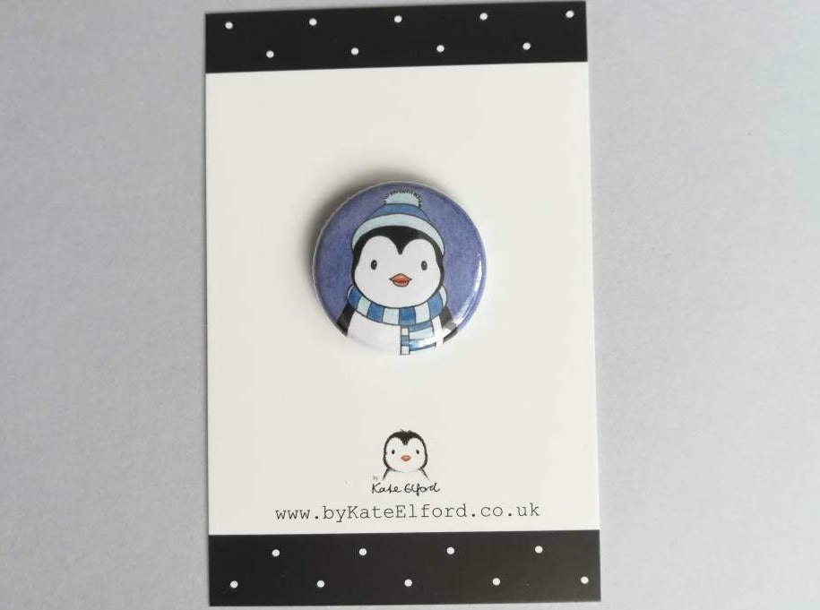 Penguin in hat and scarf badge