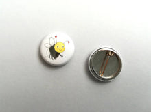 Load image into Gallery viewer, Back and front of a bee badge
