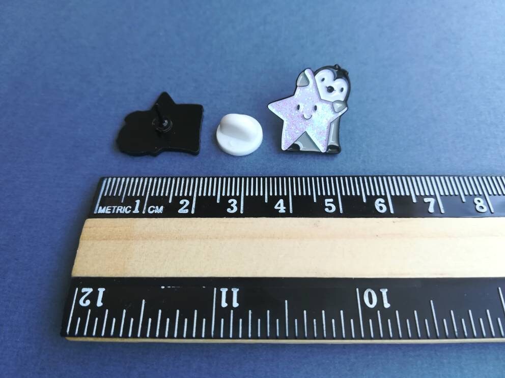 SECONDS Little penguin and sparkly star pin. Small penguin glitter enamel pin.