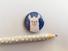 Load image into Gallery viewer, Llama button badge, a mini blue button badge with a white llama illustration and small stars in the sky
