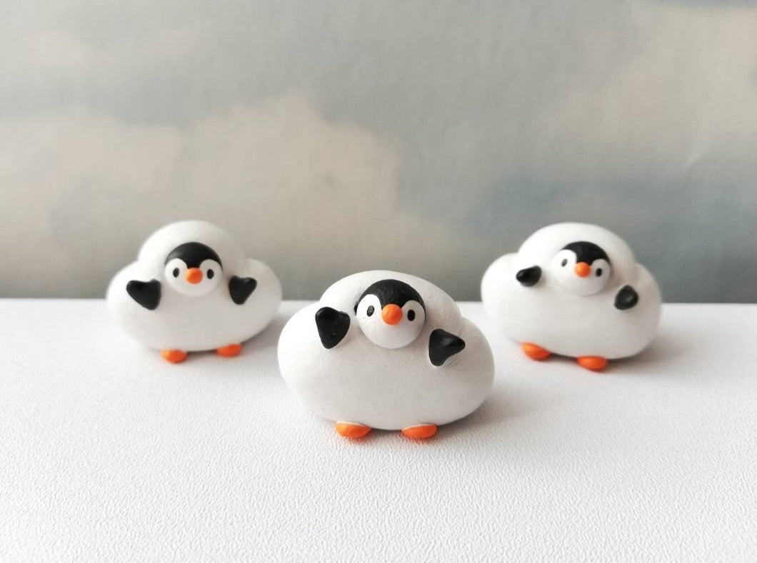 Penguin cloud. Little penguin in a box, black and white miniature pottery penguin in a white cloud, ceramic penguin gift