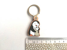 Load image into Gallery viewer, Penguin hug keyring, penguin and grey chick wooden key fob, penguin key chain, bag charm, mum, mummy, auntie, dad, nan, grandma, grandad
