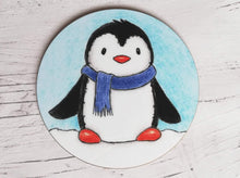 Load image into Gallery viewer, Coaster. Cute penguin in the snow wearing a blue scarf
