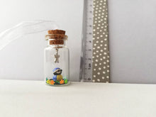 Load image into Gallery viewer, Miniature blue tit ornament. Little pottery bird in a glass bottle. Mini ornament and flower.
