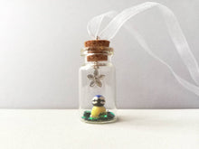Load image into Gallery viewer, Miniature blue tit ornament. Little pottery bird in a glass bottle. Mini ornament and flower.
