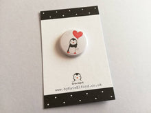 Load image into Gallery viewer, A mini button badge, with an illustration of a black and white penguin holding a red heart shaped balloon
